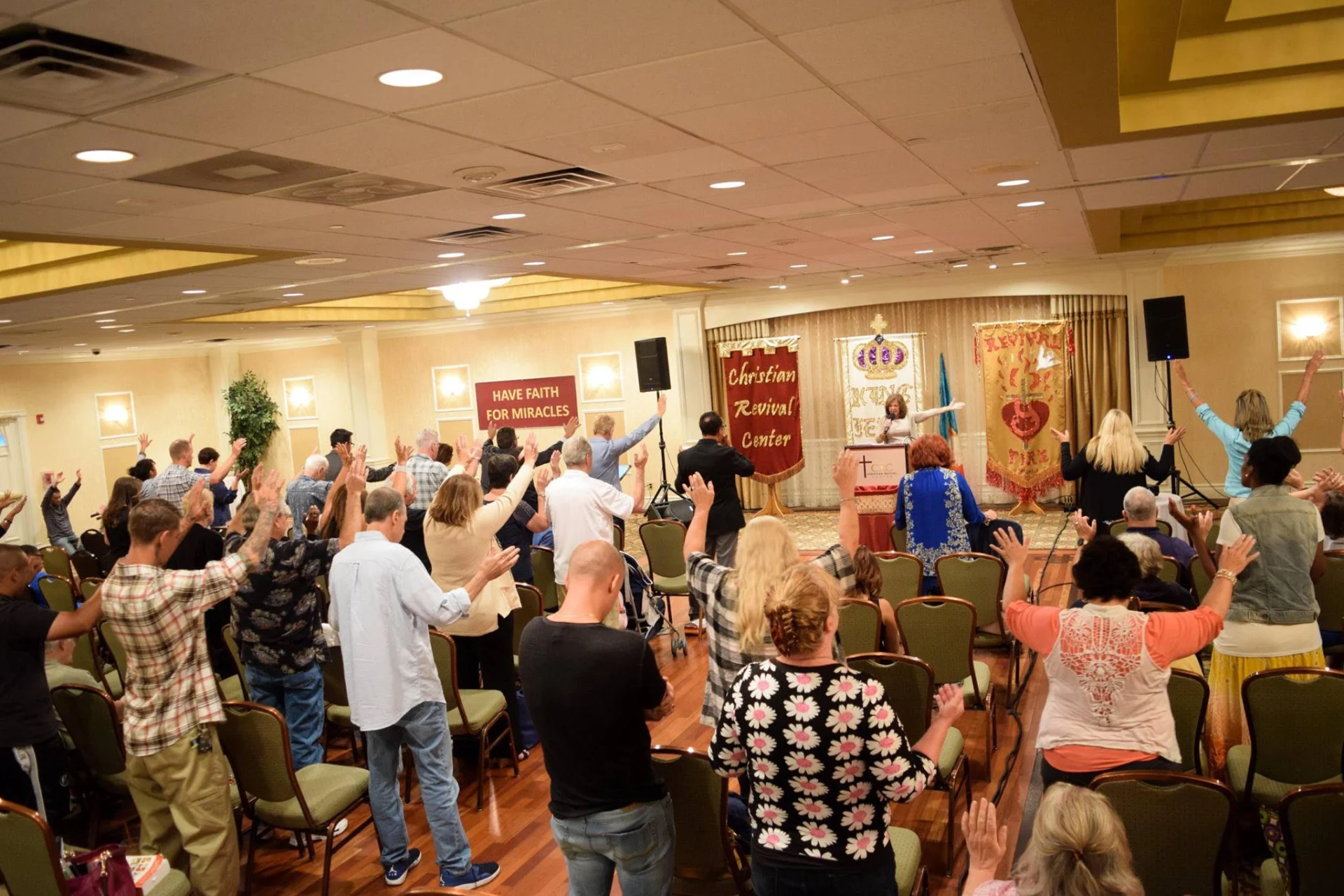 Congregation worshiping at Christian Revival Center